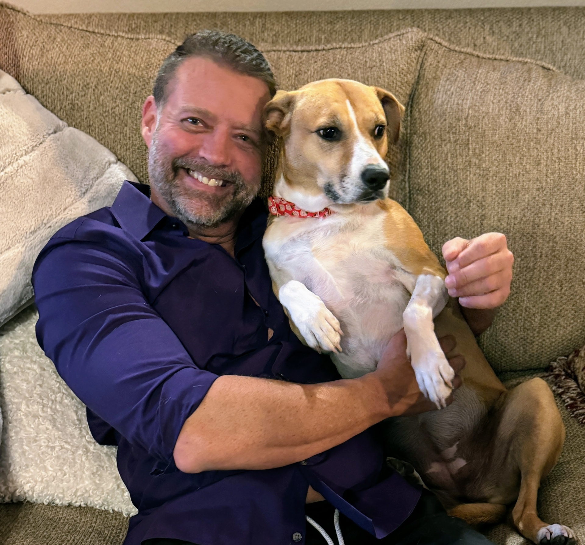 Dr. Pelton bonding with his dog at home