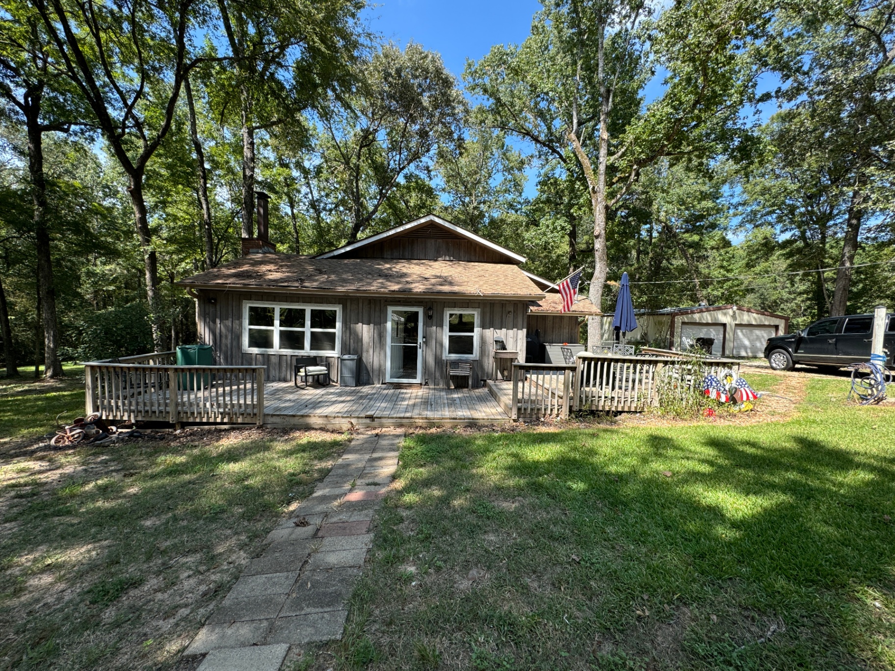 Family cabin exterior with new deck addition