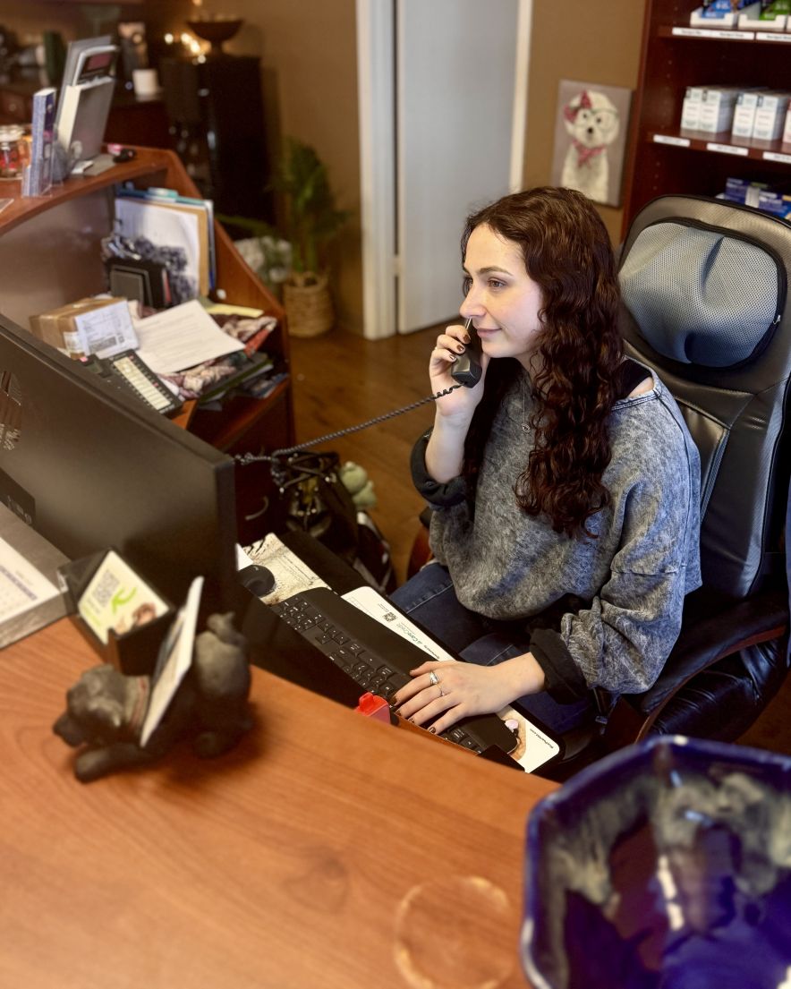 Baylee, our friendly receptionist, ready to help you